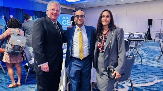 Tashu Trivedi, TFC's CEO (center), stands with two of TFC's financial reporting subject matter experts.