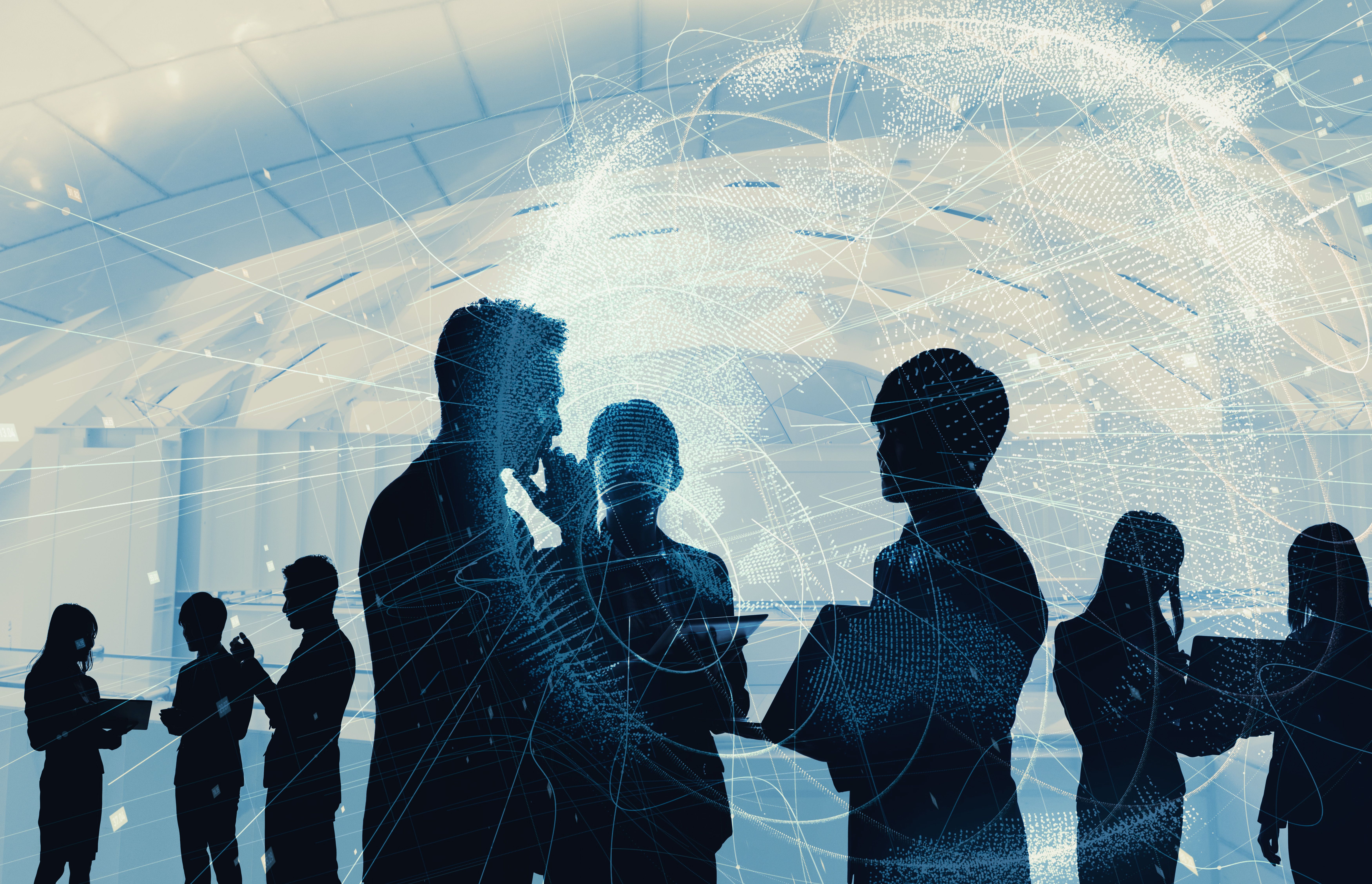 An illustration showing silhouetted young adults, in business attire, standing together in small groups and conversing. Some hold tablets or laptops. Ghosted, translucent data and grids are superimposed over the figures.